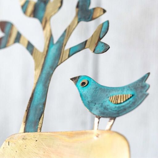 blue metal bird detail of clock