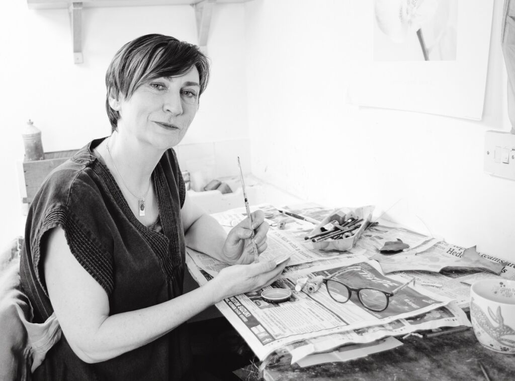 b/w portait of artist at bench