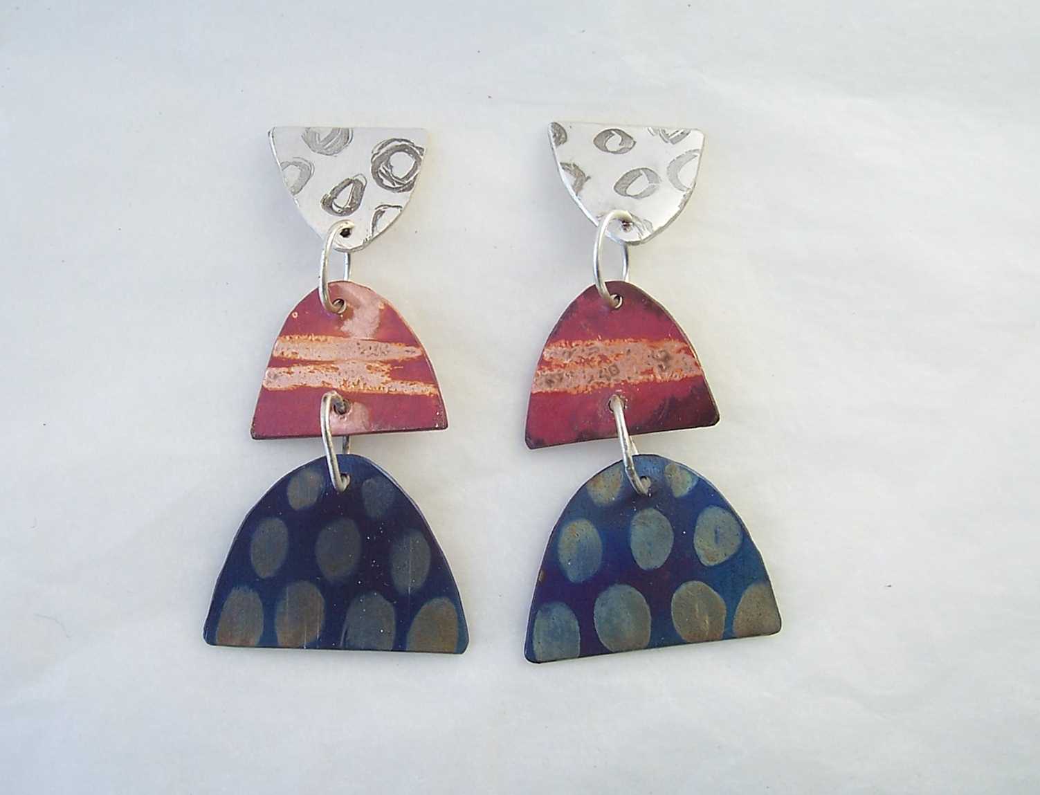 long three part earrings in silver, red and blue metal